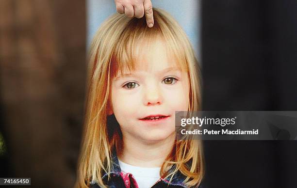 Picture of missing toddler Madeleine McCann is held by her aunt Philomena McCann as she gives television interviews after visiting Parliament on May...