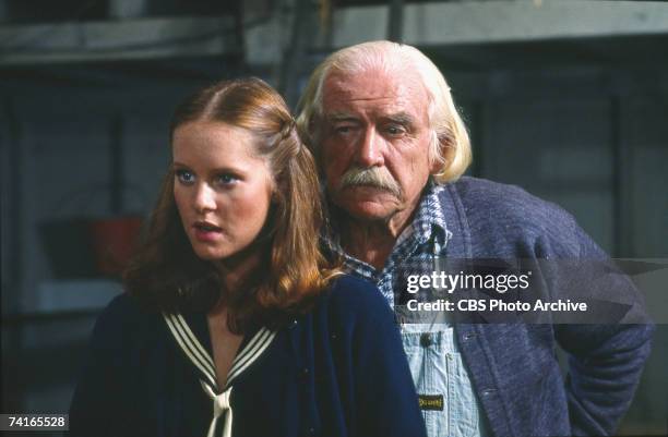 American actors Mary Elizabeth McDonough and Will Geer appear in a scene from an episode of the television family drama series 'The Waltons'...