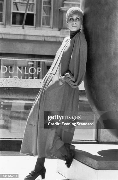 English actress Joanna Lumley models 'Smokey Red', designed by Jean Muir for the launch of a new nail varnish by Helena Rubinstein, 1975.