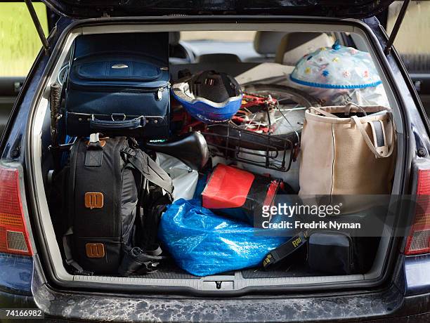 a packed trunk on a car. - packed suitcase stock pictures, royalty-free photos & images