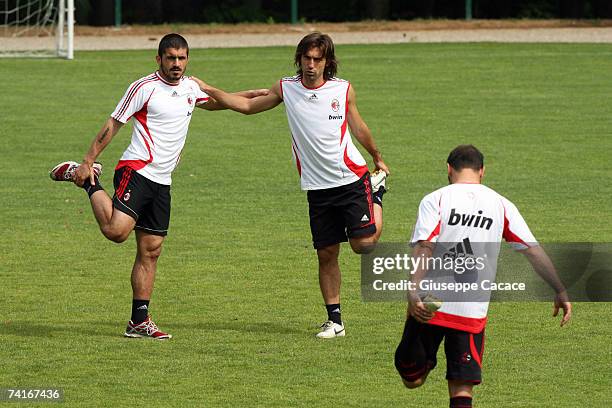 Gennaro Gattuso , Andrea Pirlo and Cristian Brocchi stretch during a training session ahead of next week's UEFA Champions League Final against...