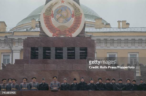 Leaders of Communist Party of the Soviet Union and Red Army generals stand together on the rostrum above Lenin's mausoleum to view the annual...
