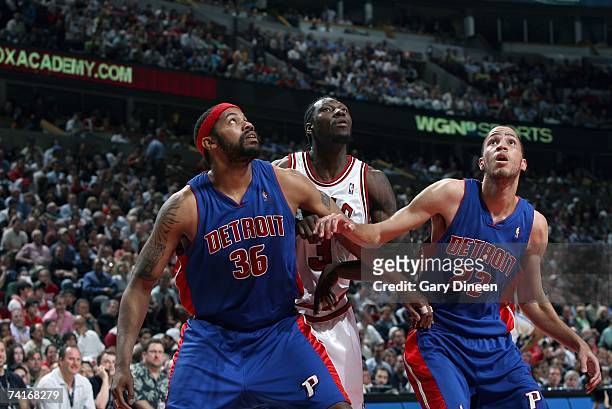 Rasheed Wallace and Tayshaun Prince of the Detroit Pistons box out Ben Wallace of the Chicago Bulls in Game Three of the Eastern Conference...