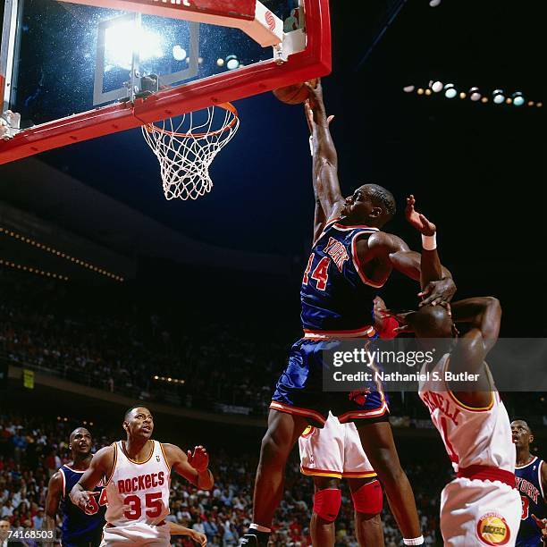 Anthony Mason of the New York Knicks dunks against Vernon Maxwell of the Houston Rockets during Game Seven of the NBA Finals played on June 22, 1994...
