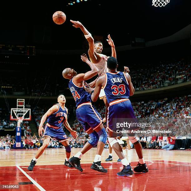 Robert Horry of the Houston Rockets passes against Patrick Ewing of the New York Knicks during Game One of the NBA Finals played on June 8, 1994 at...
