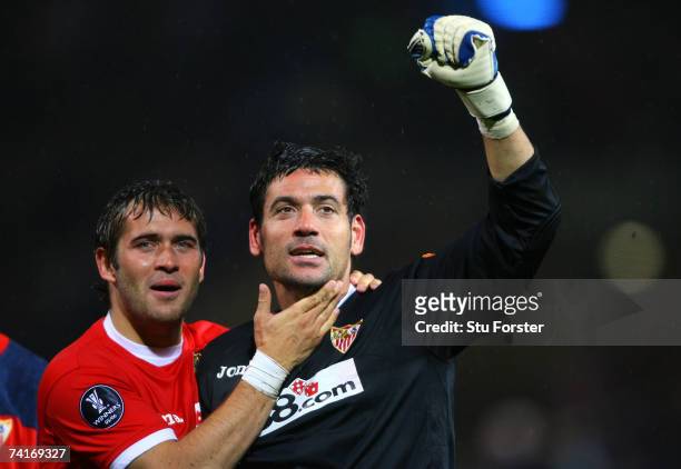 Aleksandr Kerzhakov celebrates with Andres Palop of Sevilla after their team's victory in a penalty shootout at the end of the UEFA Cup Final between...