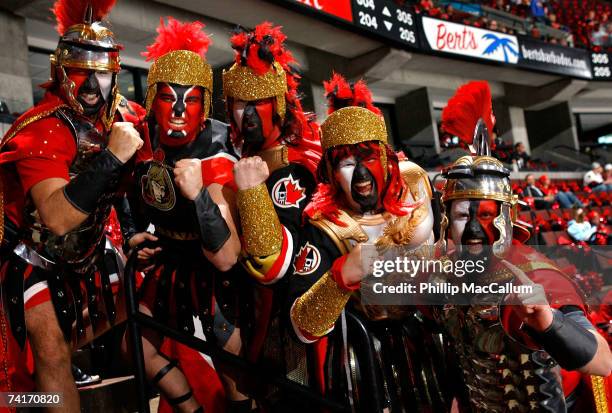 Ottawa Senators fans Jesse Jodoin, Matthew LaFontaine, Gary LaFontaine, Marc DuPont and Jean-Francois Arsenault of Ottawa cheer on their team prior...