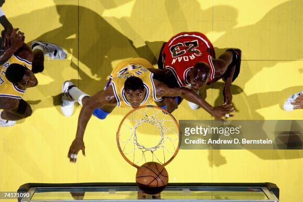 Magic Johnson of the Los Angeles Lakers battles for a rebound against Michael Jordan of the Chicago Bulls in the 1991 NBA Finals Game Four on June 9,...