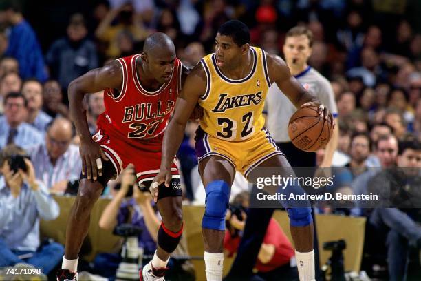 Magic Johnson of the Los Angeles Lakers posts up against Michael Jordan of the Chicago Bulls during the 1991 NBA Finals played at the Great Western...