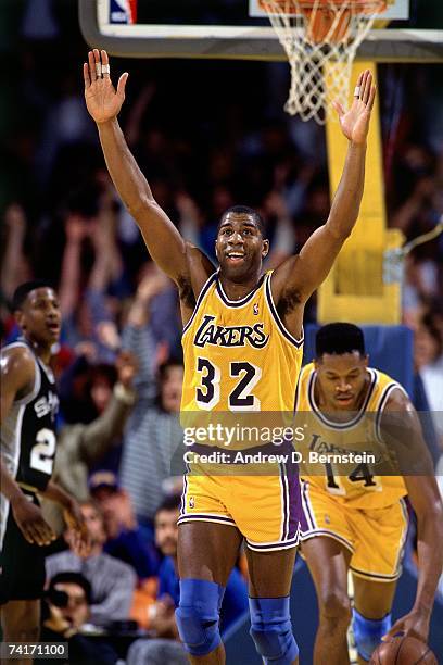 Magic Johnson of the Los Angeles Lakers celebrates a big play against the San Antonio Spurs during a 1990 NBA game played at the Great Western Forum...