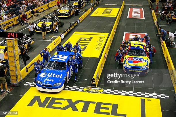 Crew members for the Alltel Dodge, compete against the crew members for the Carquest/Kellogg's Chevrolet, during the NASCAR Nextel Pit Crew Challenge...