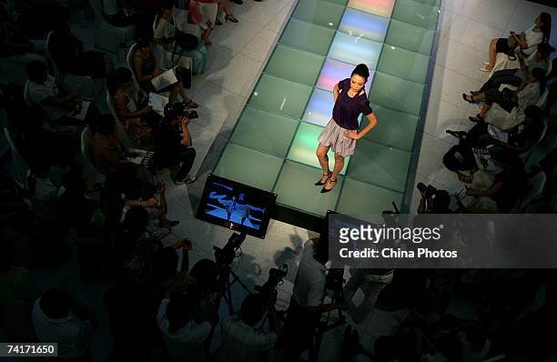 Model walks the runway during a fashion show of Korean brand Tomboy on May 16, 2007 in Xian of Shaanxi Province, China.
