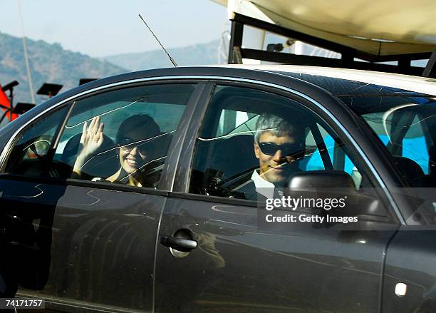 Singer Kylie Minogue waves from the back of a car driven by film director Alexander Dahm during her holiday in Chile in the town of Papudo, about...