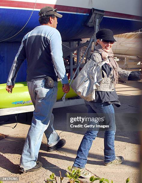 Singer Kylie Minogue smiles ahead of a boat trip during her holiday in Chile in the town of Papudo, about 190km north of Santiago, on May 7, 2007 in...