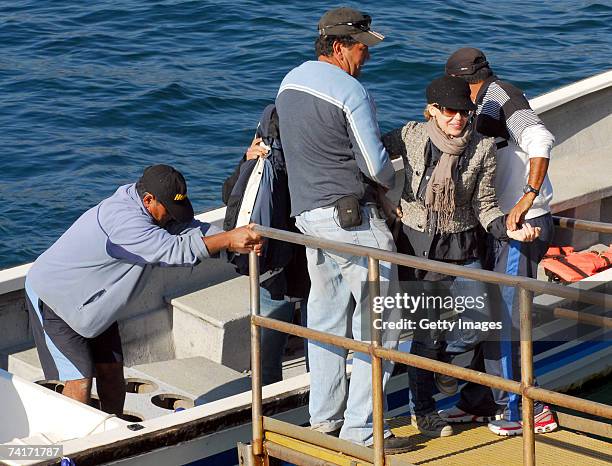 Singer Kylie Minogue and film director Alexander Dahm leave a boat during her holiday in Chile in the town of Papudo, about 190km north of Santiago,...