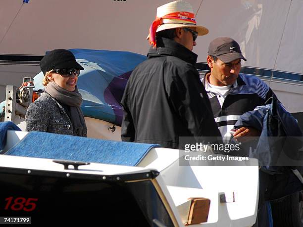 Singer Kylie Minogue and film director Alexander Dahm look at boats during her holiday in Chile in the town of Papudo, about 190km north of Santiago,...