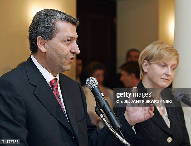 Cyprus Foreign Minister Yiorgos Lillikas gestures during a press conference with Polish counterpart Anna Fotyga during their meeting in Warsaw 17 May...