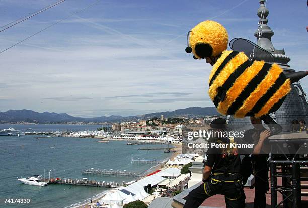 Actor Jerry Seinfeld slides down from the Carlton Hotel dressed as a bee to promote the film 'Bee Movie' during the 60th International Cannes Film...