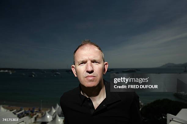 Dutch graphic artist/director Anton Corbijn poses during an interview with AFP for his film 'Control' on the roof of the Noga Hilton hotel in Cannes,...