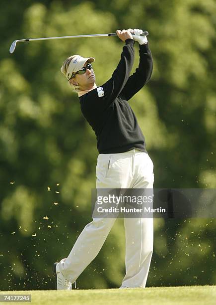Karrie Webb of Australia hits her approach shot on the 13th hole during the first round of the LPGA Sybase Classic at Upper Montclair Country Club...