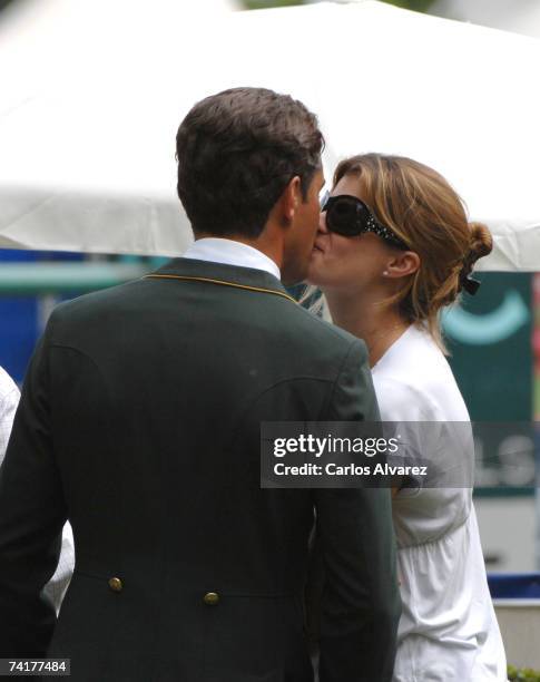 French-Greek Athina Onassis kisses her Brazilian husband Alvaro Alfonso de Miranda Neto, known as Doda Miranda, who is competing in the 97th...