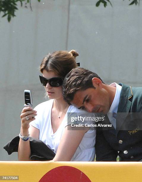 French-Greek Athina Onassis sits with her Brazilian husband, Alvaro Alfonso de Miranda Neto, known as Doda Miranda, who is competing in the 97th...