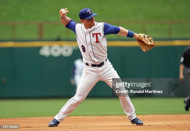 Hank Blalock of the Texas Rangers throws the ball during the game against the Toronto Blue Jays on May 6, 2007 at Rangers Ballpark in Arlington,...