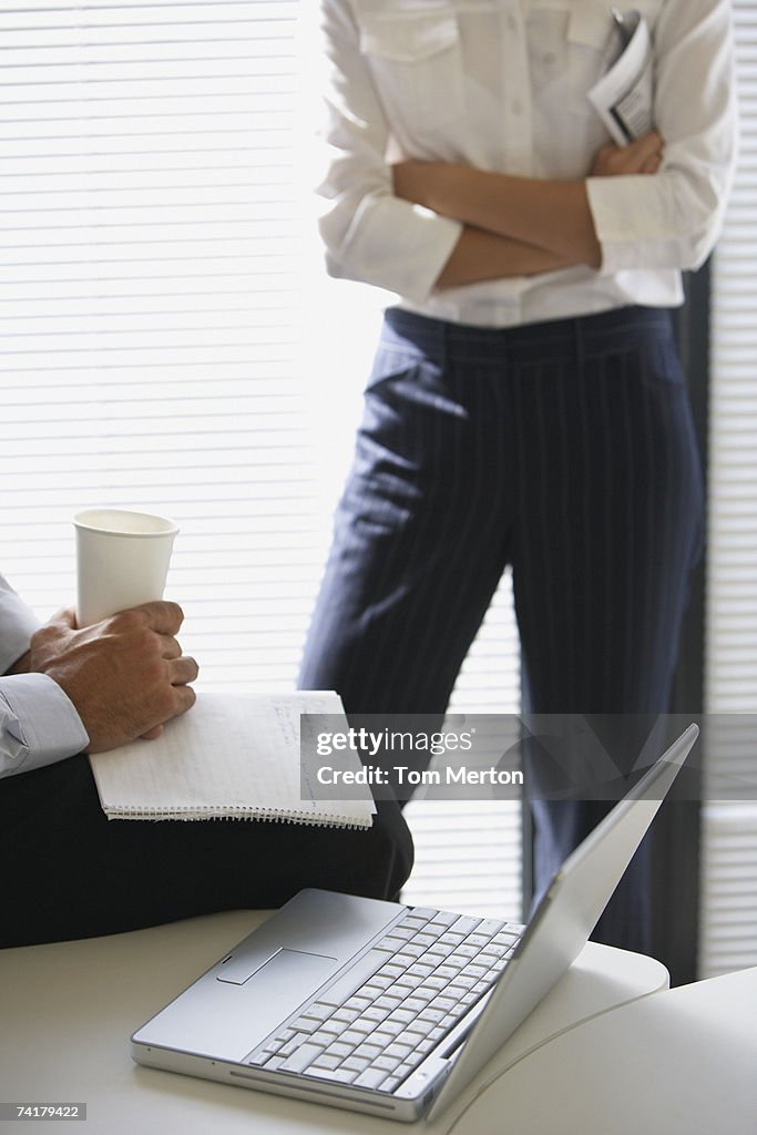 Two business colleagues talking