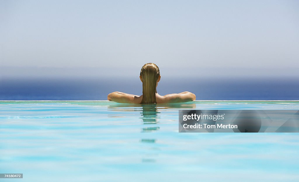 Woman in infinity pool