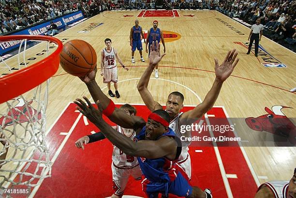 Chris Webber of the Detroit Pistons shoots a layup against P.J. Brown of the Chicago Bulls in Game Six of the Eastern Conference Semifinals during...