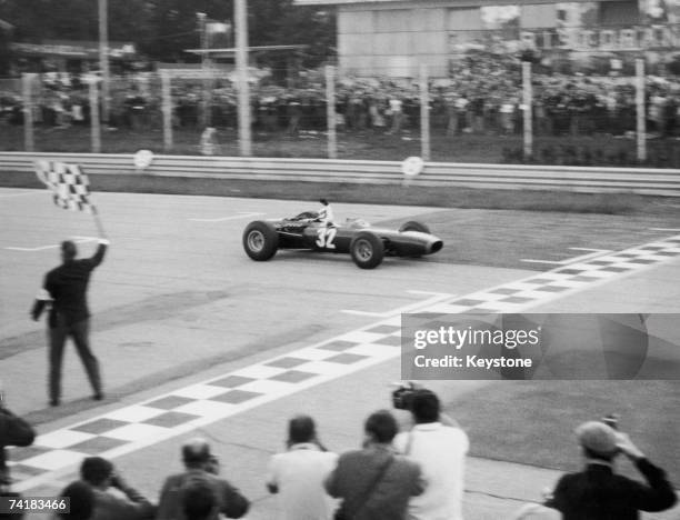 Jackie Stewart driving his BRM across the line to win the Italian Grand Prix at Monza, 12th September 1965.