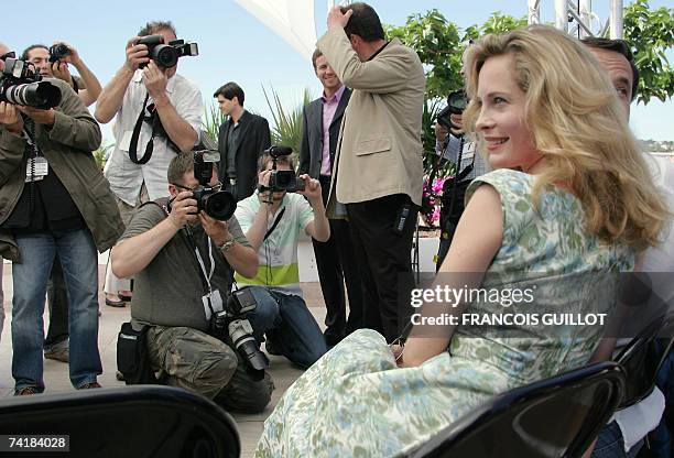Swedish actress Maria Bonnevie poses next to Russian director Andrei Zviaguintsev during a photocall for their film 'Izgnanie' at the 60th edition of...