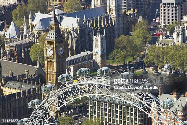 aerial view of london showing houses of parliament and london eye on the river thames - millennium wheel - fotografias e filmes do acervo