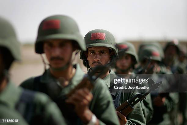 Iraqi recruits who want to be part of a new provincial security force being put together by U.S. Marines train May 18, 2007 at Camp Fallujah near...