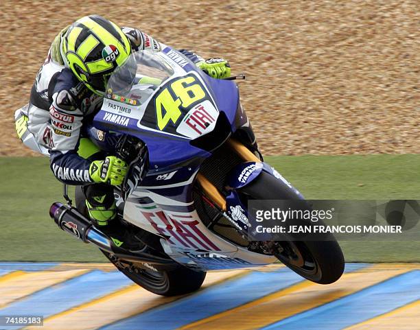 Italian MotoGP rider Valentino Rossi rounds a corner on his Yamaha during the second free practice session of the Grand Prix of France 18 May 2007 on...