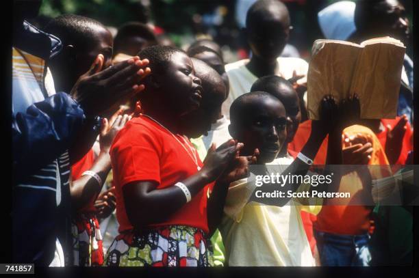 Church service is held in a refugee camp orphange, September 5, 1994 in Buhimba, Zaire. After the civil war, Hutus and Tutsis lived in refugee camps...