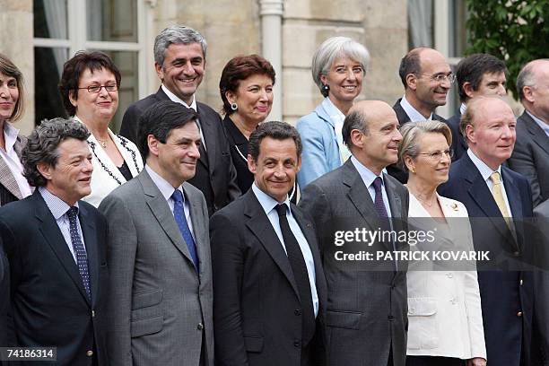 French President Nicolas Sarkozy poses with Economy, Finance and Employment Minister Jean-Louis Borloo, Prime minister Francois Fillon, France's...