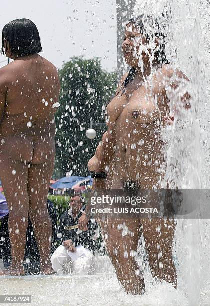 Member of the peasant organization "400 Pueblos", baths in a fountain during a protest in Mexico City, 18 May 2007. The demonstrators demand the...