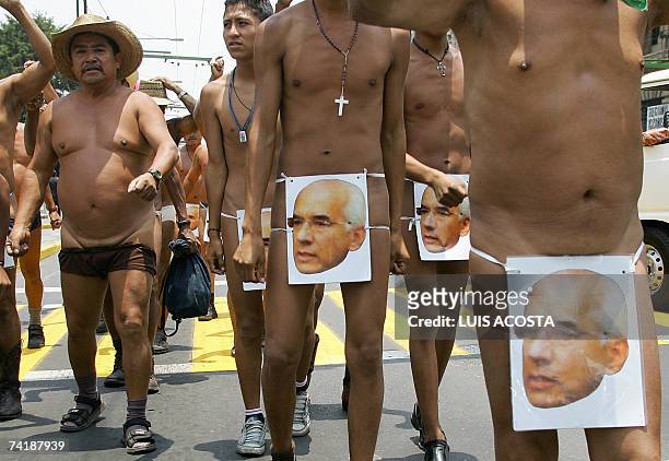 Naked peasants, members of the "400 Pueblos" organization, protest in the streets of Mexico City, 18 May 2007. The demonstrators demand the return of...