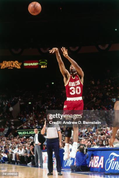 Kenny Smith of the Houston Rockets shoots during Game Three of the NBA Finals against the New York Knicks played on June 12, 1994 at Madison Square...