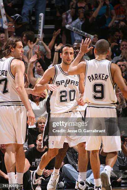 Manu Ginobili and Tony Parker of the San Antonio Spurs celebrate against the Phoenix Suns in Game Six of the Western Conference Semifinals during the...