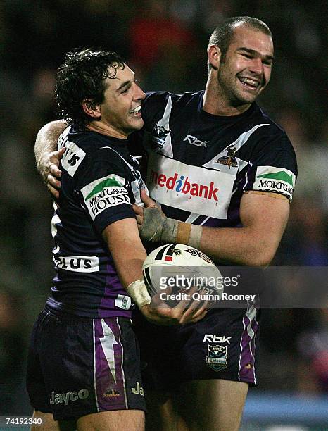 Billy Slater of the Storm is congratulated by team-mate Scott Anderson after scoring a try during the round 10 NRL match between the Melbourne Storm...