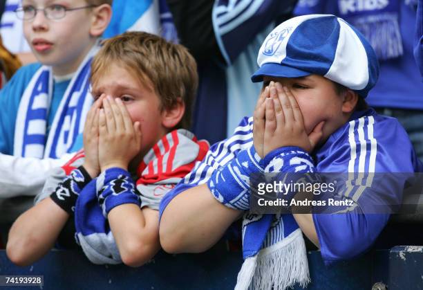 Young fans of Schalke gesture during the Bundesliga match between Schalke 04 and Arminia Bielefeld at the Veltins Arena on May 19, 2007 in...