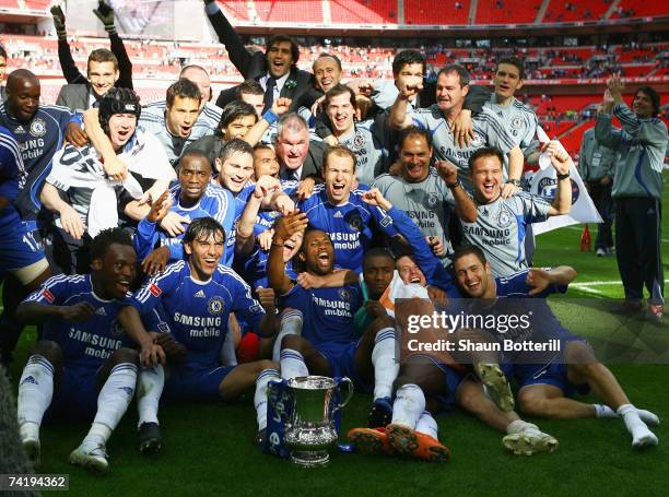 Chelsea players celebrate with the trophy following the FA Cup Final match sponsored by E.ON between Manchester United and Chelsea at Wembley Stadium...