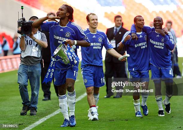 Didier Drogba of Chelsea celebrates with the trophy following the FA Cup Final match sponsored by E.ON between Manchester United and Chelsea at...