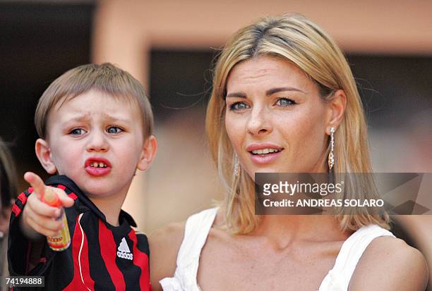 Milan's captain defender Alessandro Costacurta's wife Martina Colombari and her son Achille look on during the Italian serie A football match at...