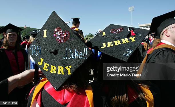 Liberty University graduating students wear "I Love Jerry" caps during the school's 34th commencement ceremony, the first without Rev. Jerry Falwell,...