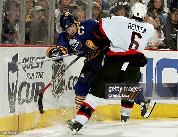 Wade Redden of the Ottawa Senators collides with Daniel Briere of the Buffalo Sabres during the second period of Game 5 of the 2007 Eastern...