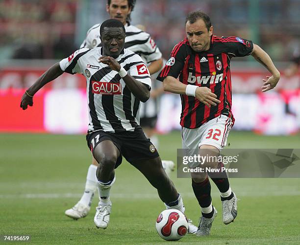Christian Brocchi of Milan and Obodo of Udinese in action during the Serie A match between AC Milan and Udinese at the San Siro stadium on May 19,...