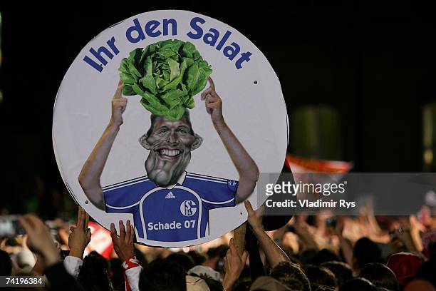 Fans present a banner parody on Schalke 04 during the VfB Stuttgart champion's party at Schloss square on May 19, 2007 in Stuttgart, Germany. VfB...
